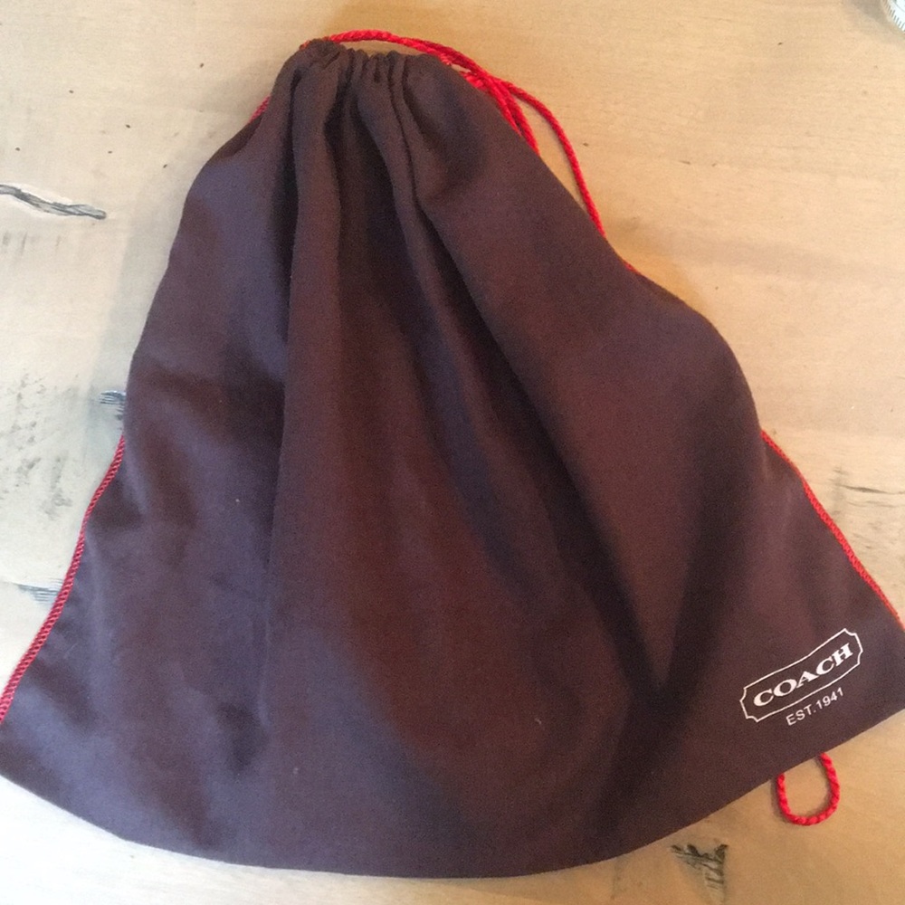 Chocolate brown Coach drawstring storage bag with red drawstring